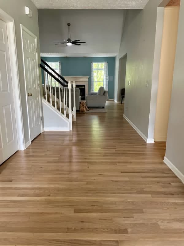 Oak hardwood flooring carried through the entry and main living space